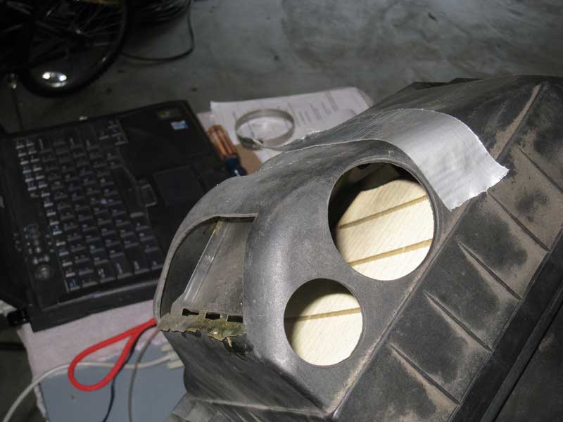 Modified airbox with baffle and two holes