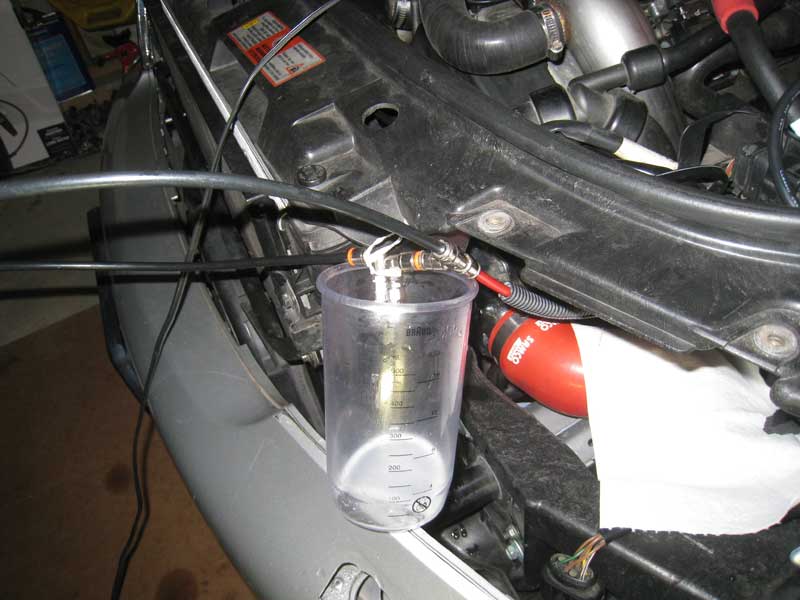 Aquamist nozzles into liquid container